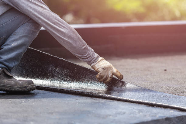 Professional Basement Waterproofing technician working in Ivins, UT